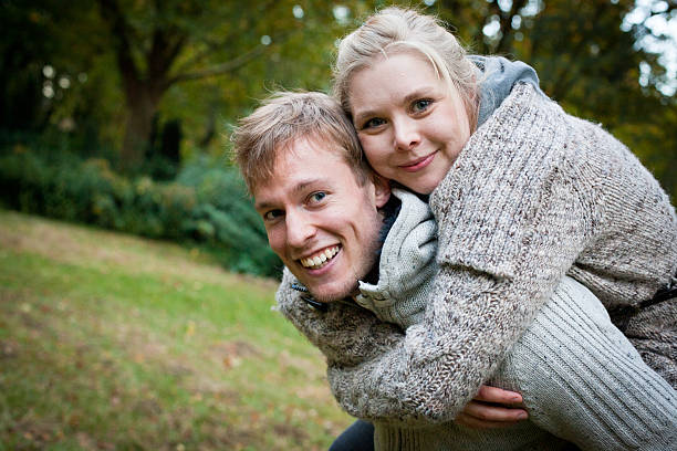 istock amorous couple with fun in the park 174920506