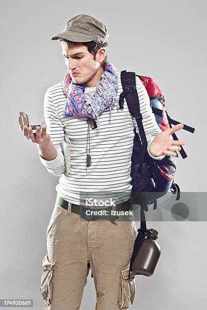 Confused Male Traveller Stock Photo - Download Image Now - Holding, Studio Shot, Young Men