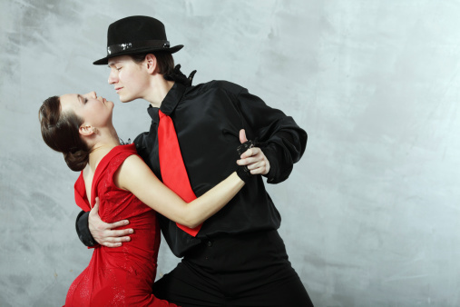 pair of dancers dancing in the studio