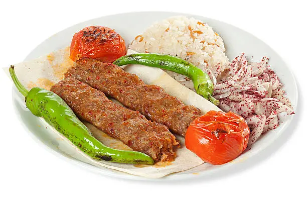 Middle eastern traditional food kebab, isolated on white with shadow and contains a clipping path with 3-4 px tolerance.