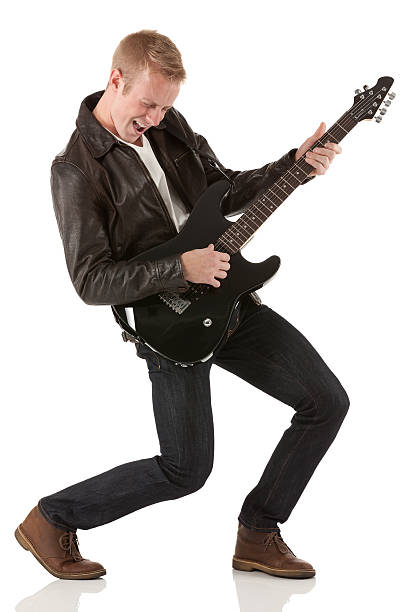 istock Excited young man playing a guitar 174921159