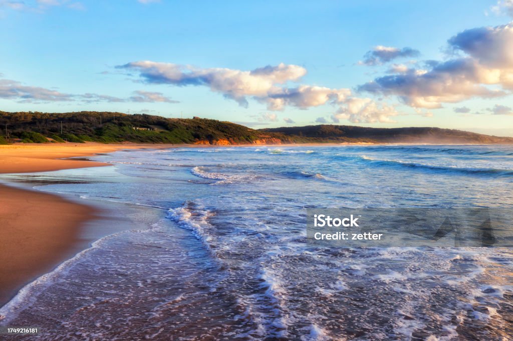 CHB Sand beach wave Middle Camp beach at Catherine Hill bay coastal town of Australia on Pacific ocean - soft morning light. Australia Stock Photo