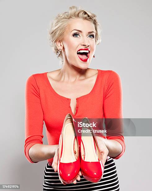 Elegant Woman With Red High Heels Stock Photo - Download Image Now - Holding, Women, Love - Emotion