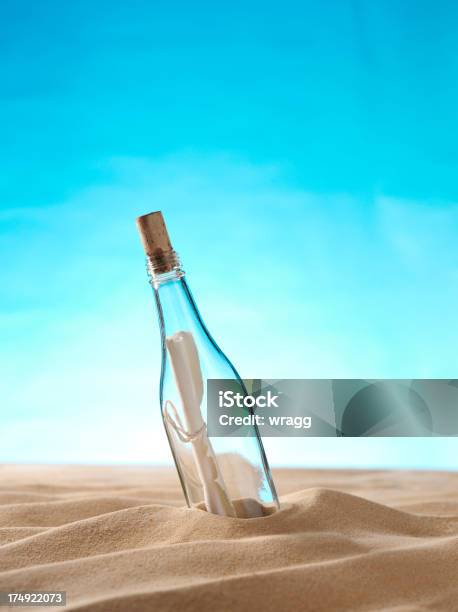 Message In A Bottle On The Sand Stock Photo - Download Image Now - Bottle, Sand, Beach
