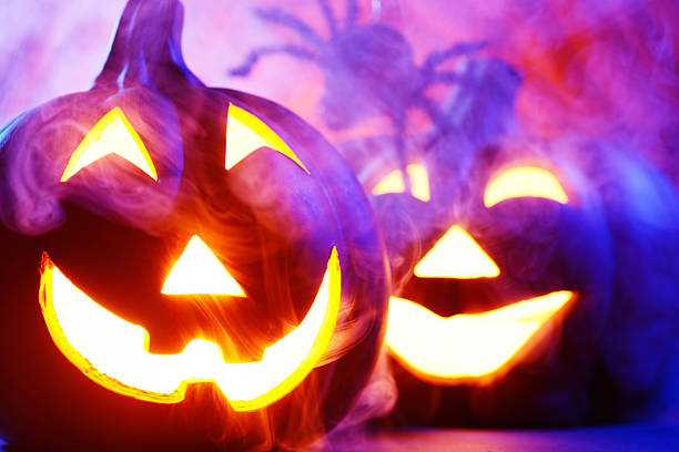 istock Halloween pumpkins in dark blue with spider web and smoke 174922286