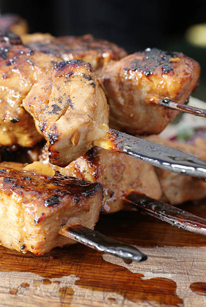 Barbecued Tuna cubes on a skewer stock photo