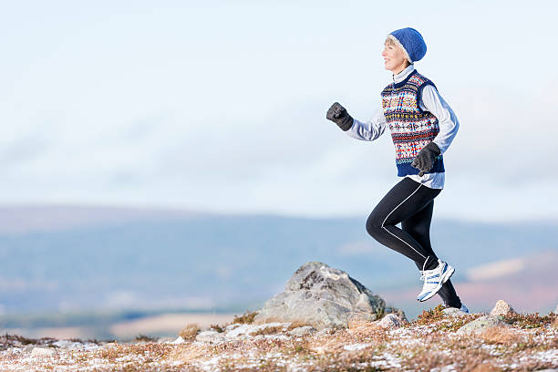 istock Woman jogging in winter in mountains 174922679