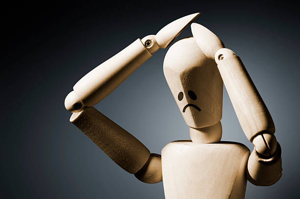 istock Manequin expressing despair with hands on head 174922826