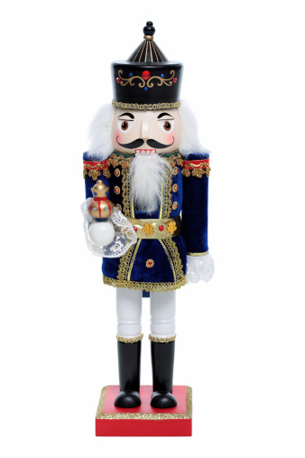 A nutcracker doll isolated on a white background ready for display at Christmas.