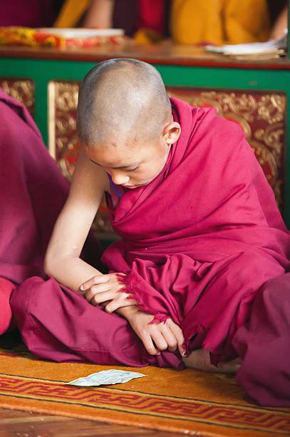 istock Little Monk and Money 174923063