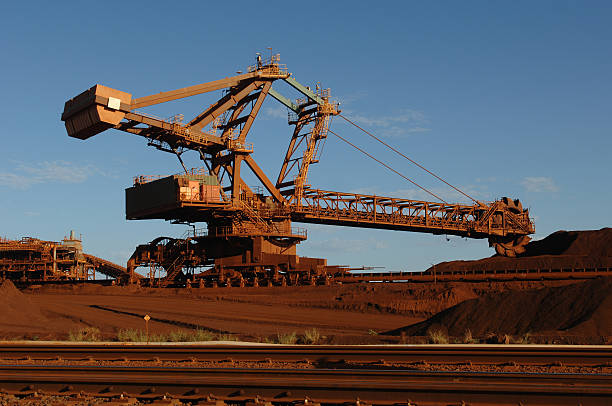 istock Iron ore reclaimer working in a stockyard. 174923311
