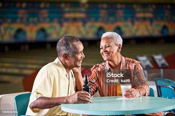 Senior Couple In Bowling Alley Stock Photo - Download Image Now - Beer - Alcohol, Drinking, African Ethnicity