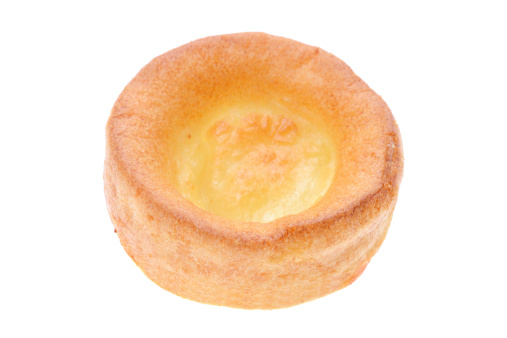 Freshly baked Yorkshire Pudding  - Studio shot with a white background