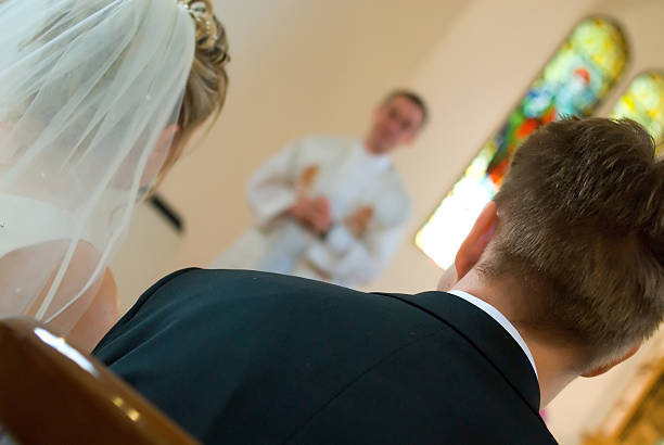 istock Priest adressing bride and groom 174924121