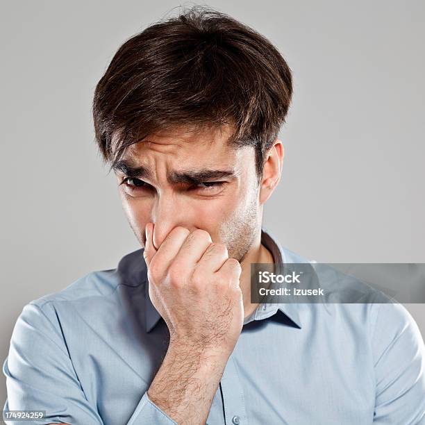 Man Pinches Nose Stock Photo - Download Image Now - Nose, Pinching, Unpleasant Smell