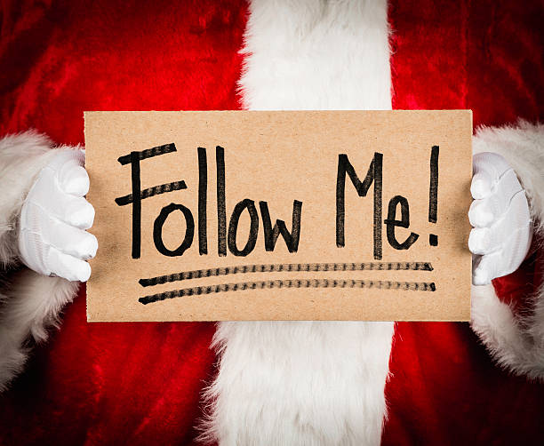 istock Santa with Follow Me Sign 174924593