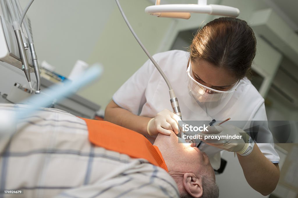 Paciente y al dentista en dentistas oficina - Foto de stock de Adulto libre de derechos