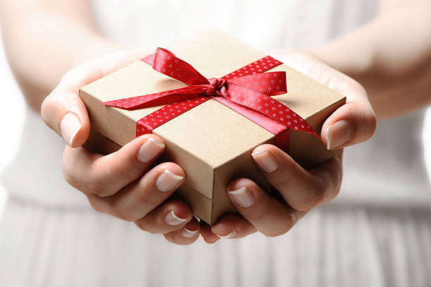 istock Woman holding a gift box 174924905