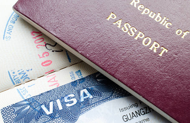 istock USA visa and Chinese passport 174925081