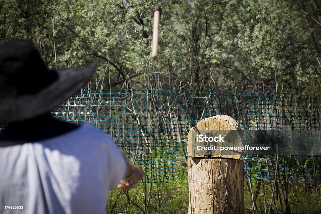 Axe Throwing A man throwing an axe, axe in blurred motion. Axe Throwing Stock Photo