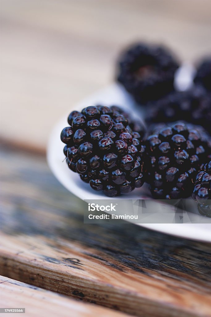 blackberries close-up of blackberries on a plate Blackberry - Fruit Stock Photo
