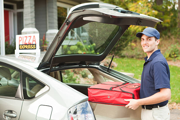 istock Pizza Delivery Man with Take-out Package Arriving at Customer Hz 174925627