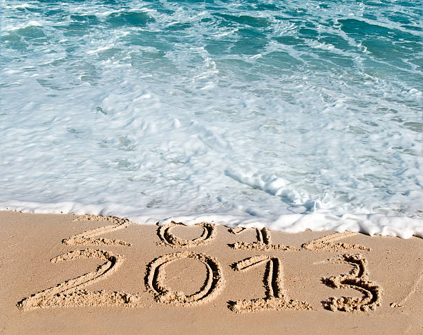 ano novo na praia de 2013 - 2013 beach sand new years day imagens e fotografias de stock
