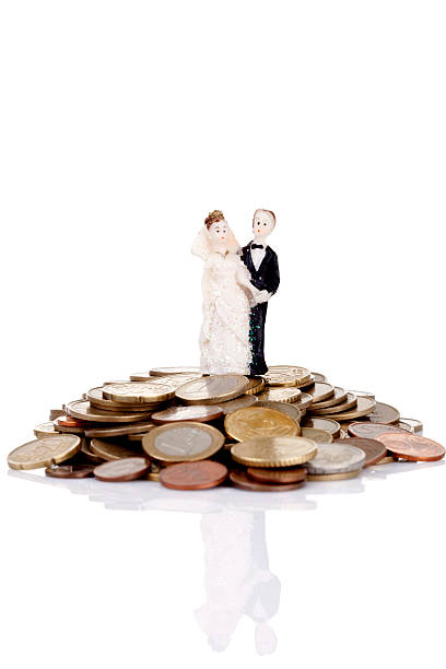 istock Heap of coins  with wedding cake topper 174926232