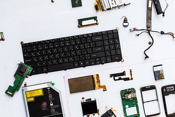 Broken Keyboard and Electronic Hardware Pieces of pc and phones hardware disassembling stock pictures, royalty-free photos & images