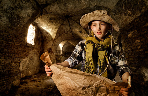 Young boy exploring old tunnel stock photo