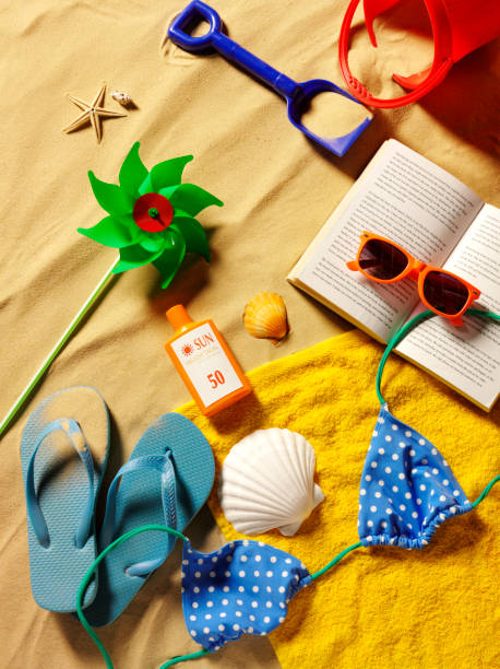 istock Bucket and Spade on the Beach with an Open Book 174926450