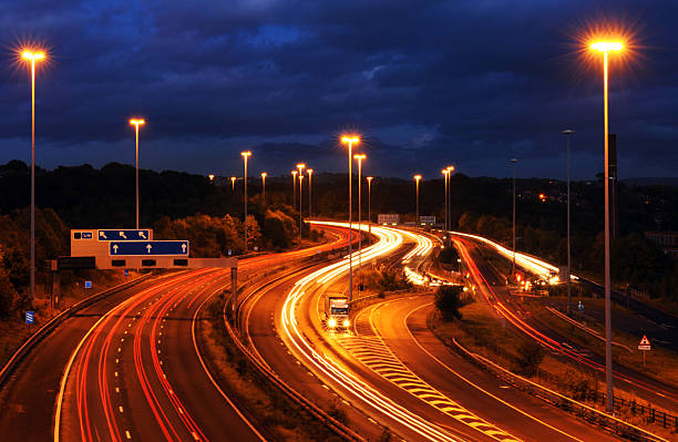 Goods Vehicle Breakdown at Dusk on Motorway with Light Trails stock photo