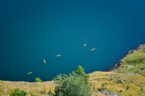 Group of yellow kayaks in the Aurlandsfjord in Norway.