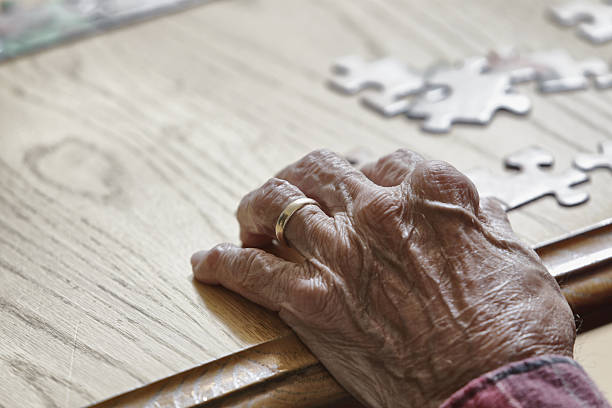 istock Senior Man's Hand and Jigsaw Puzzle 174927150
