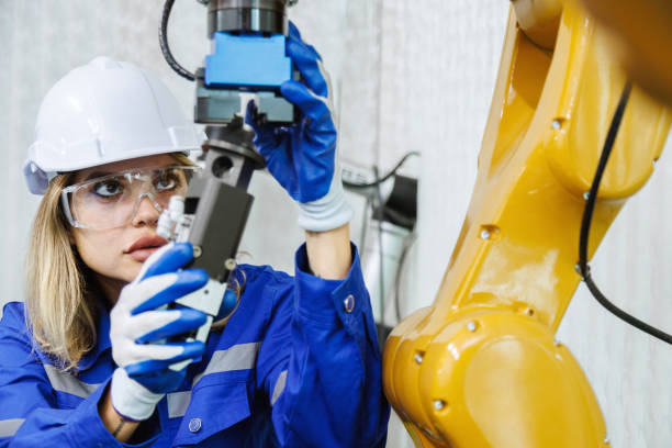istock female automation machine engineer student study and inspection control robot arm machine in university or factory workshop. ai robot technology new innovation trend of manufacturing in industry 5.0 1749275868