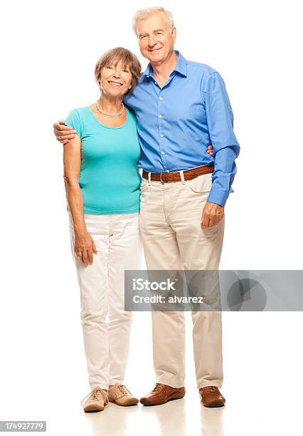 Photo libre de droit de Couple Senior Embrassant banque d'images et plus d'images libres de droit de Fond blanc - Fond blanc, Couple senior, Troisième âge