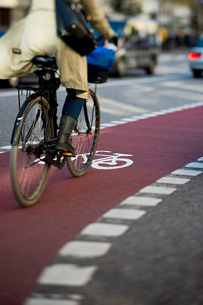 istock Woman on bicycle in traffic 174927932