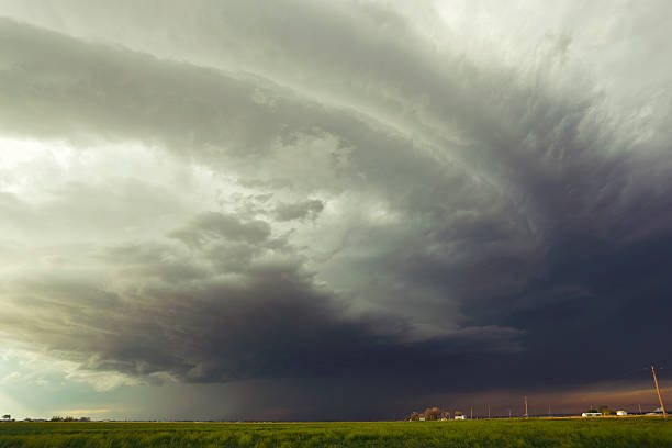 istock Large dangerous storm sweeps over farm 174928016