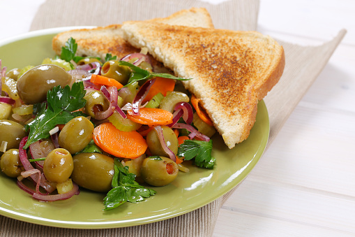 Plate of Sicilian olive salad and toasted bread