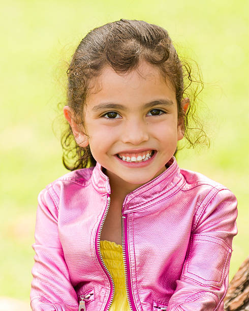 Cute Girl in Pink Jacket Smiling stock photo