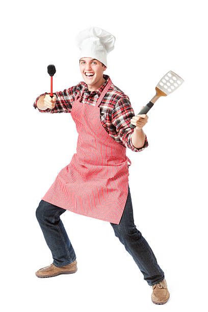 Subject: An happy animated outdoor grilling chef holding grilling tools on white background.