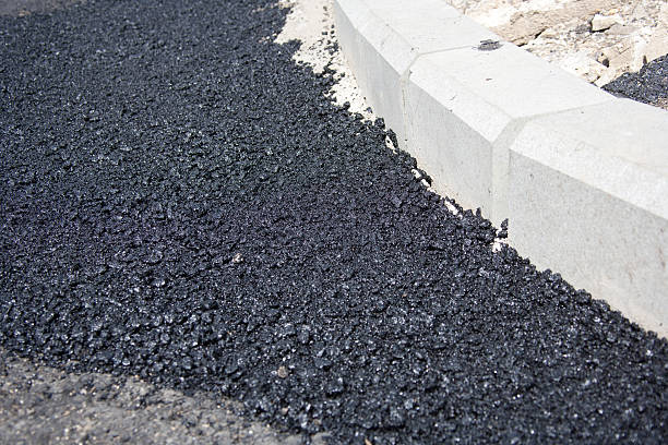 istock Fresh Layer Of Asphalt with Granite Curbs 174929686