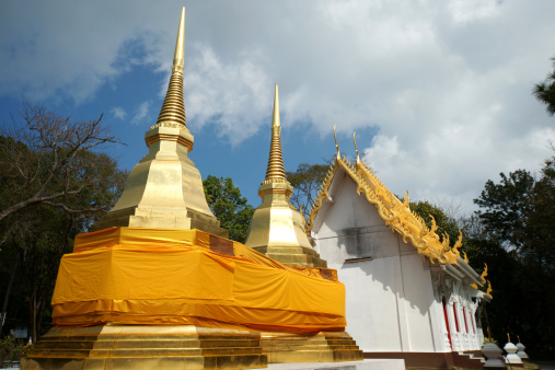 Doi Tung Golden pagoda with yellow cloth around at Chiang Rai Province Thailand
