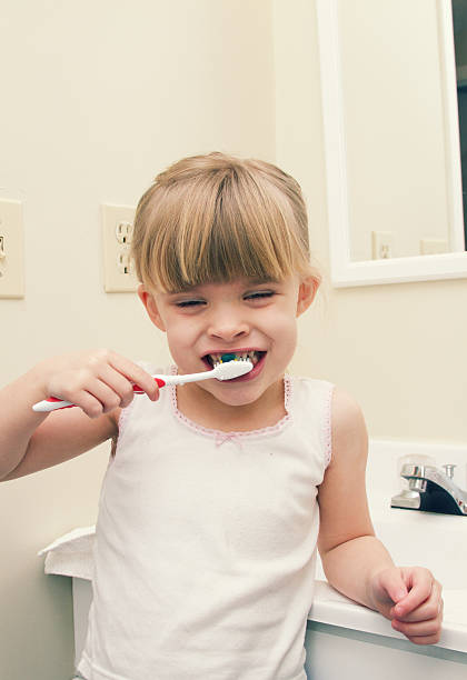 istock Little Girl Brushing Teeth 174930179
