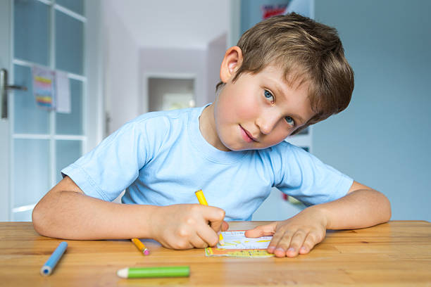 istock portrait of small boy drawing 174930211