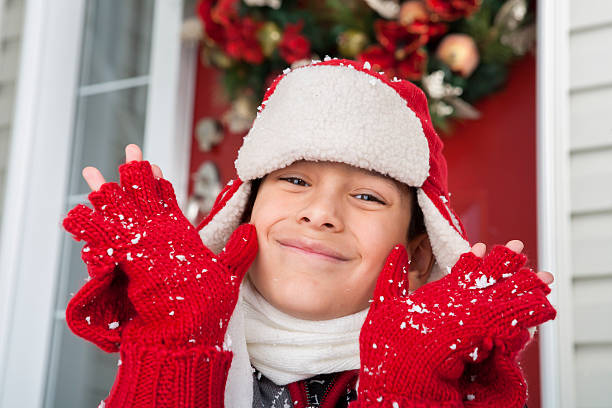 istock Christmas-Young boy playing with snow 174930292