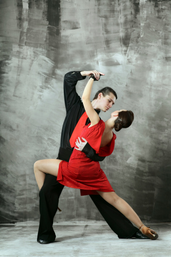pair of dancers dancing in the studio
