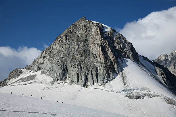 istock Alpine mountain scene with hikers 174930668