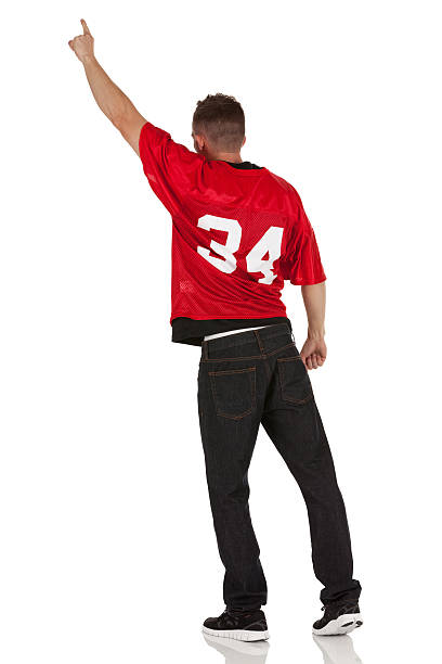 istock Rear view of a man standing with finger raised 174930689