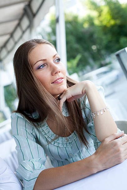 istock Young Attractive Woman Sitting In Cafe 174930737